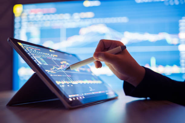 Woman looking stock market Data on smart phone Woman looking stock market Data on smart phone Market Strategy stock pictures, royalty-free photos & images